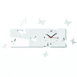 Modern wall clock made of plexiglass. Trendy clock on the wall as a gift. X-momo clocks. PMMA